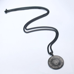 Black stainless steel Nordic Viking rune pendant necklace with Celtic knot on white background