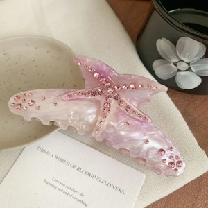Pink starfish acetate hair claw clip with rhinestones and marble texture for women