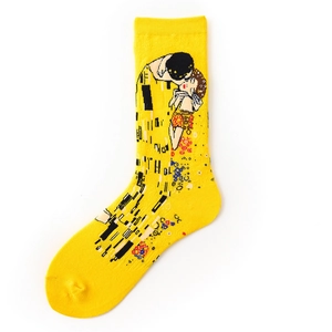 Detail of cotton crew socks in vibrant yellow featuring Klimt's The Kiss art print