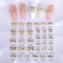 Detailed catalog of metal bow nail charms with precise dimensions and SKU model numbers