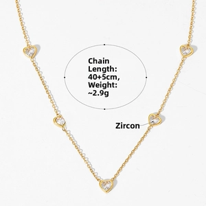 Detail of gold heart zircon necklace with 40+5cm length and 2.9g weight specifications