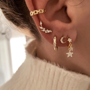 Elegant gold S925 star moon earring set with micro-set zircon on female model