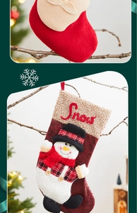 Detail of Christmas stocking with Santa and Snowman embroidery on rustic branches