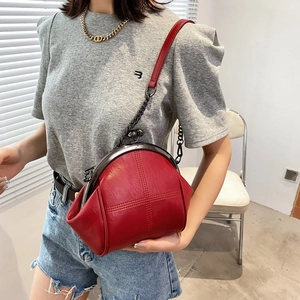 Chic red PU leather shell bag with woven chain strap and retro clasp closure