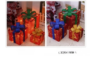 Three-piece red Christmas gift box set with LED lights and elk patterns shown in two lighting modes