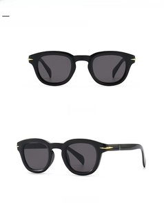 Front and 45 degree side view of black round sunglasses with gold arrow metal accents