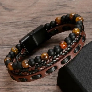 Detail view of multi-layer leather bracelet with tiger eye beads and black magnetic clasp