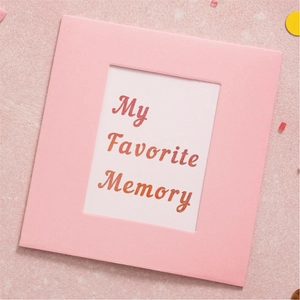 Close-up of pink glitter My Favorite Memory photo frame card with soft paper texture