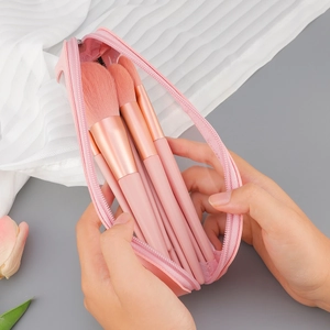 Portable 10-piece pink makeup brush set with rose gold metal and matching storage bag