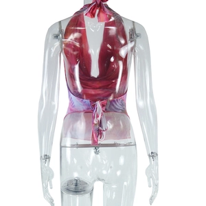 Detail of pink floral halter top featuring open back design and adjustable neck ties