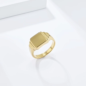 Minimalist square signet ring in gold finish with polished mirror surface and ribbed sides