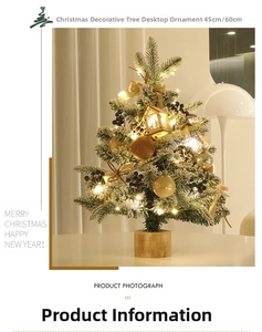 Close-up of 60cm flocked Christmas tree with warm lights, pine cones and ornaments