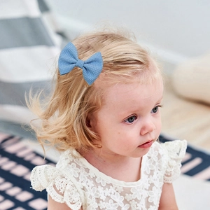 Blue waffle knit bow hair clip for toddlers, handmade fabric bow for kids' hair styling