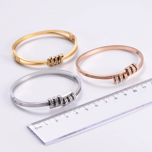 Detailed size view of three crystal-inlaid titanium steel bracelets in gold, rose gold and silver