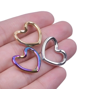 Polished stainless steel heart-shaped connectors in gold, silver, and rainbow finishes