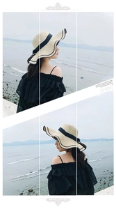 Detail of beige straw sun hat with black ribbon bow for summer beach vacation