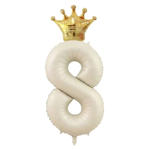 Detail of cream number 8 balloon with a gold crown for birthday party decoration