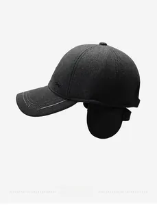 Detail of winter baseball cap showing thick fabric texture and folded ear protection