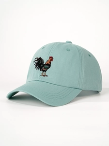 Detailed embroidery of a colorful rooster on a light teal cotton baseball cap