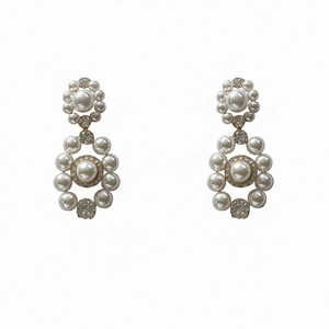 Elegant vintage pearl drop earrings with silver pins and cubic zirconia accents