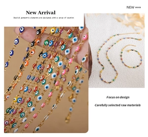 Detail of colorful Evil Eye charm necklaces and bracelets with gold finish chains