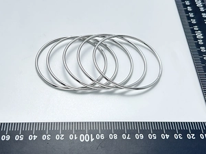 Detailed measurement of five 65mm silver stainless steel minimalist bangle bracelets