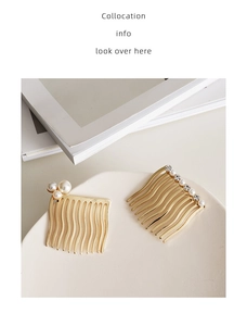 Detail of gold hair combs with pearls and rhinestones on a white ceramic plate
