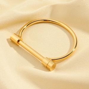 Minimalist gold horseshoe D-shaped stainless steel bangle with polished finish for women