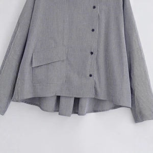 Women's plaid button-down shirt with chest pocket and curved asymmetric hemline