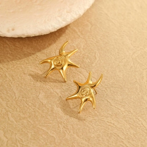 Exaggerated 18K gold plated starfish earrings with spiral texture on stone surface