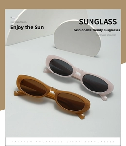 Detailed view of vintage oval sunglasses in pastel beige and tortoiseshell finish