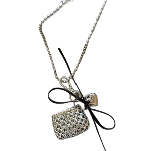 Elegant beaded necklace with woven bag heart and knot pendants on a white background
