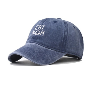 Detail of CAT MOM embroidery on washed navy blue cotton canvas baseball cap