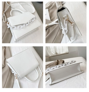 Detailed views of white PU leather crossbody bag with chain handle and gold hardware