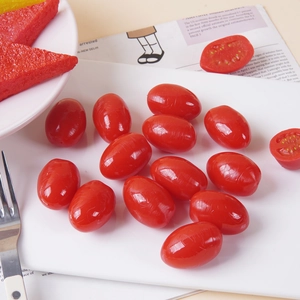 Artificial cherry tomato models on a plate with realistic texture and cross-section details