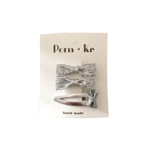 3-piece set of silver glitter cat bows and fabric hair clips on a white display card