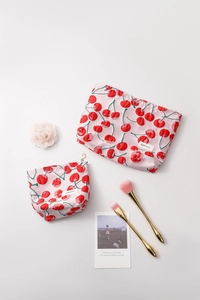 Detail of red cherry print cosmetic bag set with decorative flower metal zipper puller