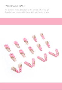 Detail of long ballerina fake nails with pink marble texture and gold glitter accents
