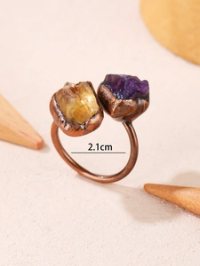 Macro shot of bronze adjustable ring with raw amethyst and citrine stones and 2.1cm diameter