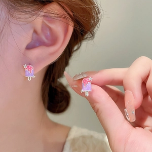 Detail shot of purple and pink enamel ice cream stud earrings on silver base
