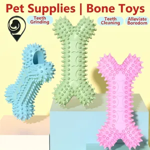 Giochi per cani a forma di osso in TPR per pulizia dentale in blu, verde e rosa