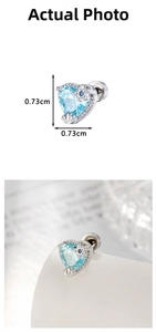 Macro detail of heart-shaped light blue zircon stud earring with star accents and size specs