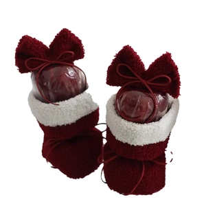 Christmas red plush stocking boots with white faux fur trim for holiday DIY bouquet decor