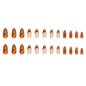 Orange almond press-on nails with butterfly wing pattern and polka dot accents