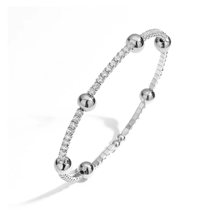 Detail of silver adjustable bangle featuring smooth beads and sparkling zircon stones inlay