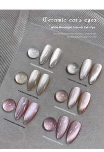 Detail view of cat eye nail gel color palette showing silver and pink pearlescent effects