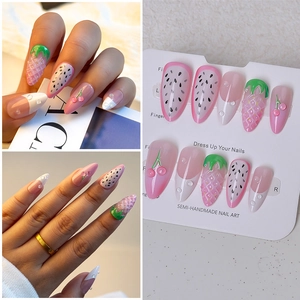 Detail of 3D strawberry and cherry press-on nails with sweet pink gradient texture