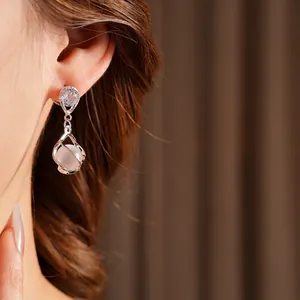 Elegant opal water drop earrings with silver needles and hollow cage pendant for women