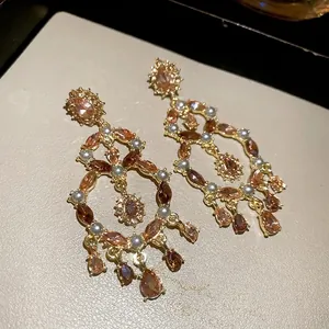 Vintage gold drop earrings with amber stones and white pearls in hollow carved design