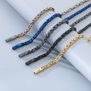 Detail of Byzantine hip-hop bracelets in gold, black, steel, blue and rainbow finishes